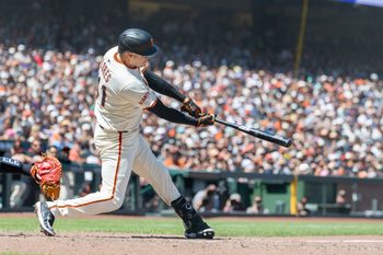 Jun 19, 2025; San Francisco, California, USA; San Francisco Giants first base Wilmer Flores (41) hits a double to score 2 runs during the seventh inning against the Cleveland Guardians at Oracle Park. Mandatory Credit: Bob Kupbens-Imagn Images