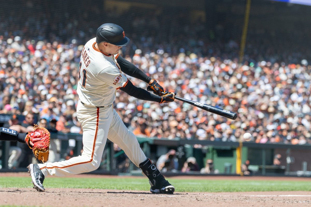 Jun 19, 2025; San Francisco, California, USA; San Francisco Giants first base Wilmer Flores (41) hits a double to score 2 runs during the seventh inning against the Cleveland Guardians at Oracle Park. Mandatory Credit: Bob Kupbens-Imagn Images