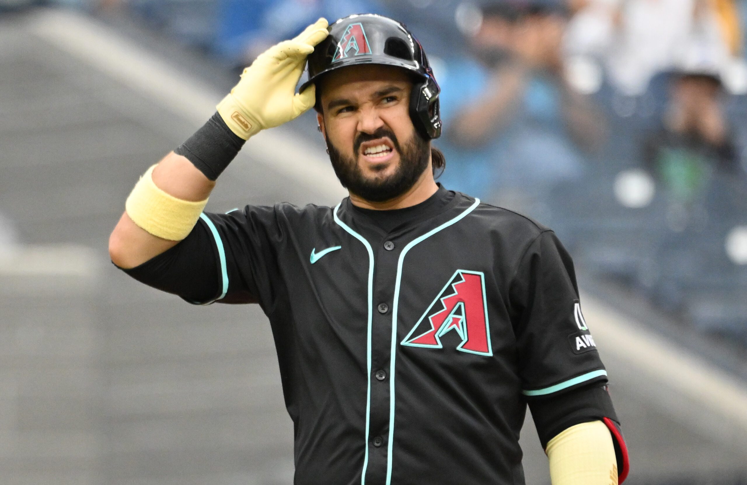 Jun 19, 2025; Toronto, Ontario, CAN;  Arizona Diamondbacks third baseman Eugenio Suarez (28) reacts after striking out against the Toronto Blue Jays in the ninth inning at Rogers Centre. Mandatory Credit: Dan Hamilton-Imagn Images