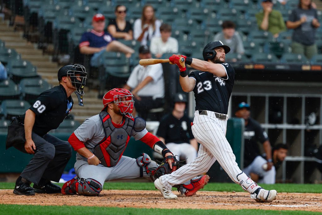 Jun 19, 2025; Chicago, Illinois, USA; Chicago White Sox left fielder Andrew Benintendi (23) hits a grand slam against the St. Louis Cardinals during the seventh inning of game two of a doubleheader at Rate Field. Mandatory Credit: Kamil Krzaczynski-Imagn Images