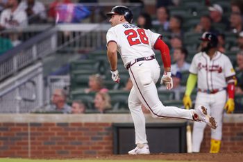 Jun 19, 2025; Atlanta, Georgia, USA; Atlanta Braves first baseman Matt Olson (28) hits a double against the New York Mets in the eighth inning at Truist Park. Mandatory Credit: Brett Davis-Imagn Images