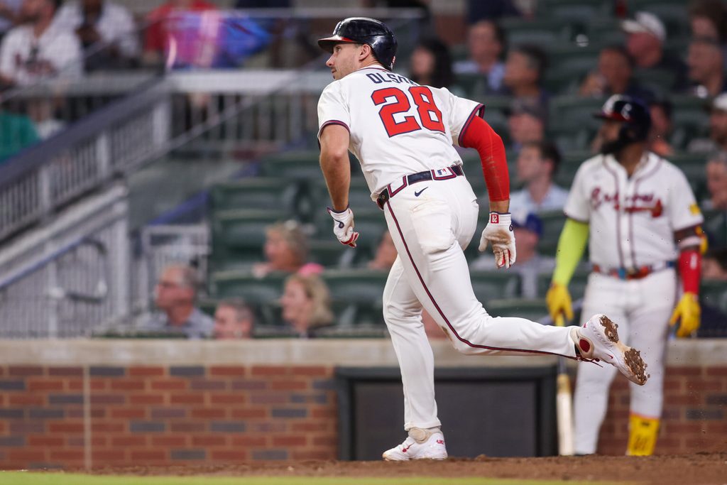 Jun 19, 2025; Atlanta, Georgia, USA; Atlanta Braves first baseman Matt Olson (28) hits a double against the New York Mets in the eighth inning at Truist Park. Mandatory Credit: Brett Davis-Imagn Images