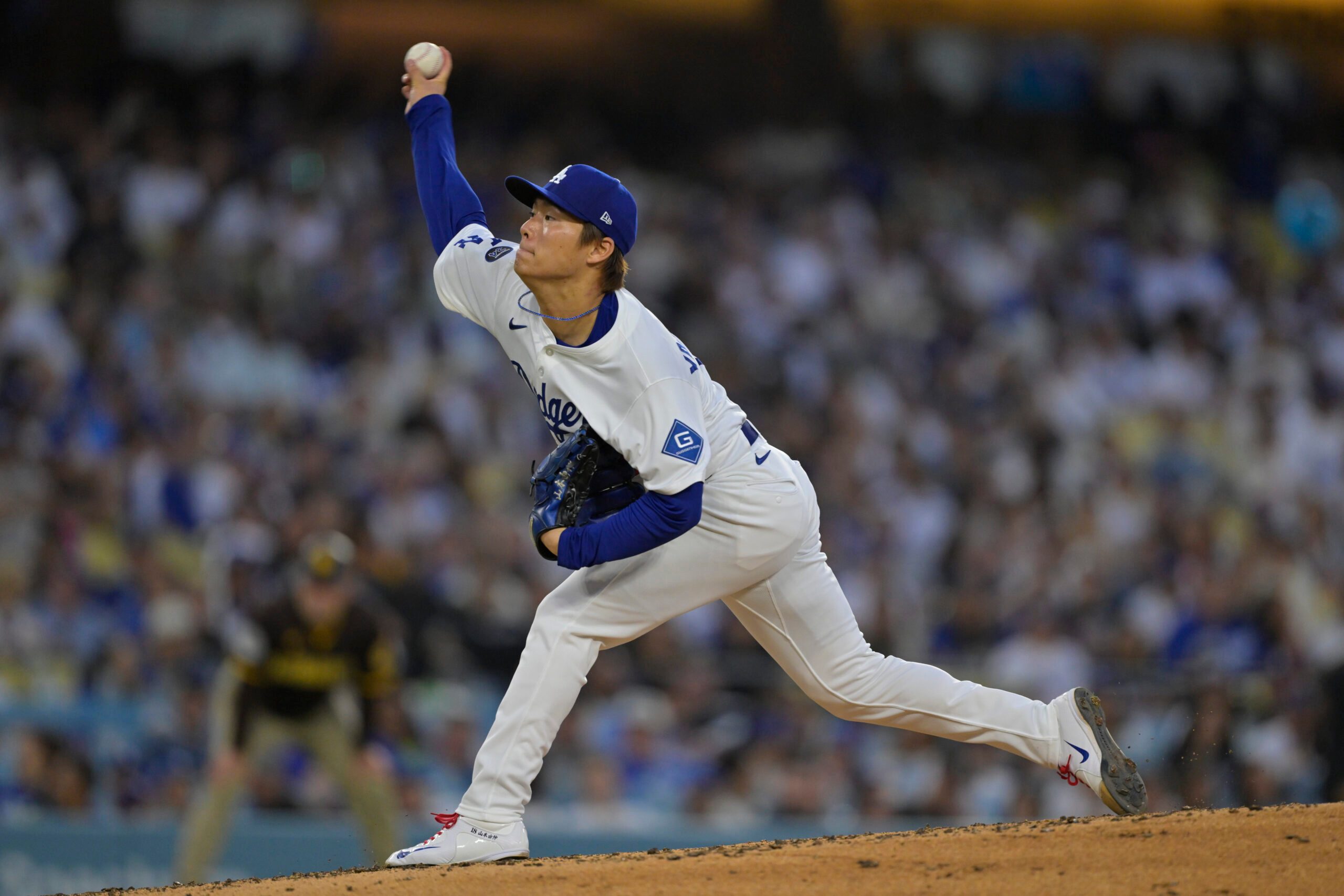 Jun 19, 2025; Los Angeles, California, USA;  Los Angeles Dodgers pitcher Yoshinobu Yamamoto (18) delivers a pitch during the fourth inning against the San Diego Padres at Dodger Stadium. Mandatory Credit: Jayne Kamin-Oncea-Imagn Images