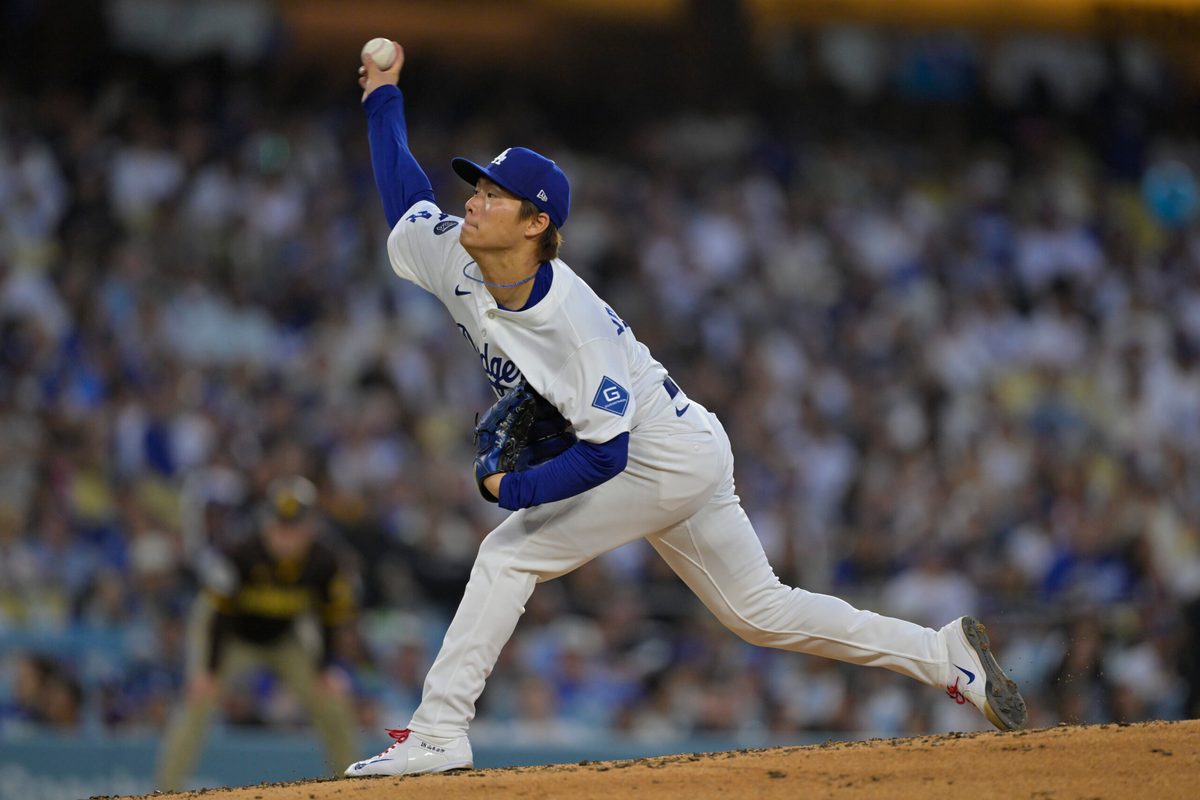 Jun 19, 2025; Los Angeles, California, USA; Los Angeles Dodgers pitcher Yoshinobu Yamamoto (18) delivers a pitch during the fourth inning against the San Diego Padres at Dodger Stadium. Mandatory Credit: Jayne Kamin-Oncea-Imagn Images