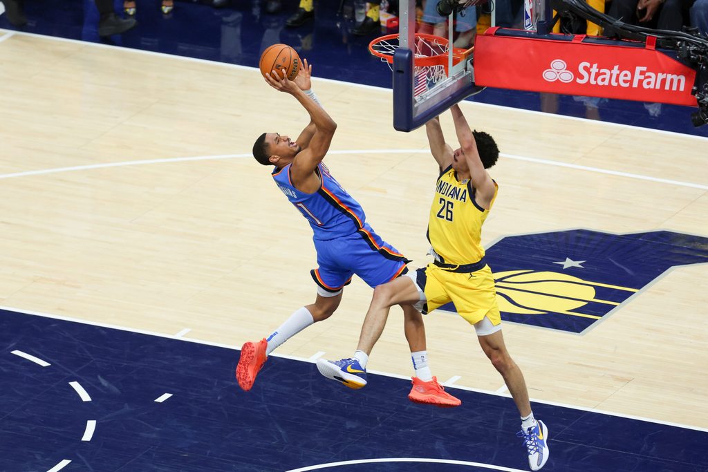 Jun 19, 2025; Indianapolis, Indiana, USA; Oklahoma City Thunder guard Aaron Wiggins (21) shoots the ball defended by Indiana Pacers guard Ben Sheppard (26) in the fourth quarter during game six of the 2025 NBA Finals at Gainbridge Fieldhouse. Mandatory Credit: Trevor Ruszkowski-Imagn Images