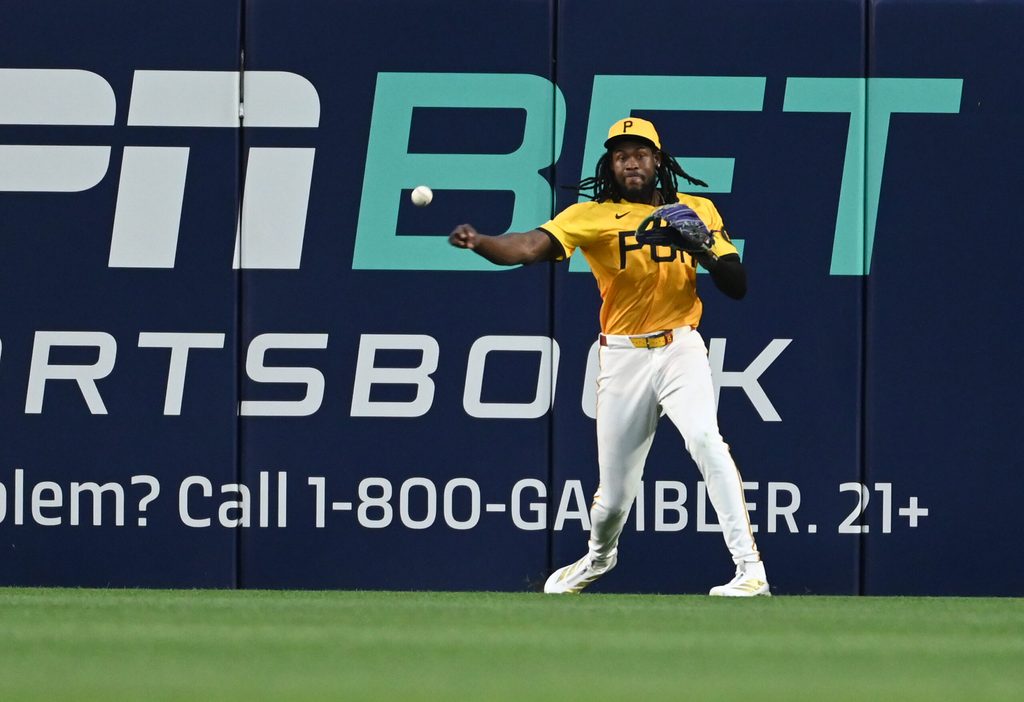 Jun 11, 2025; Pittsburgh, Pennsylvania, USA; Pittsburgh Pirates center fielder Oneil Cruz plays the ball against the Texas Rangers at PNC Park. Mandatory Credit: Philip G. Pavely-Imagn Images