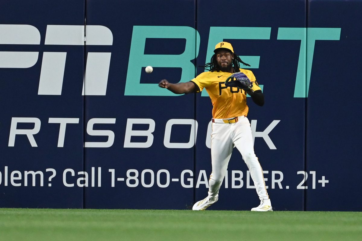 Jun 11, 2025; Pittsburgh, Pennsylvania, USA; Pittsburgh Pirates center fielder Oneil Cruz plays the ball against the Texas Rangers at PNC Park. Mandatory Credit: Philip G. Pavely-Imagn Images