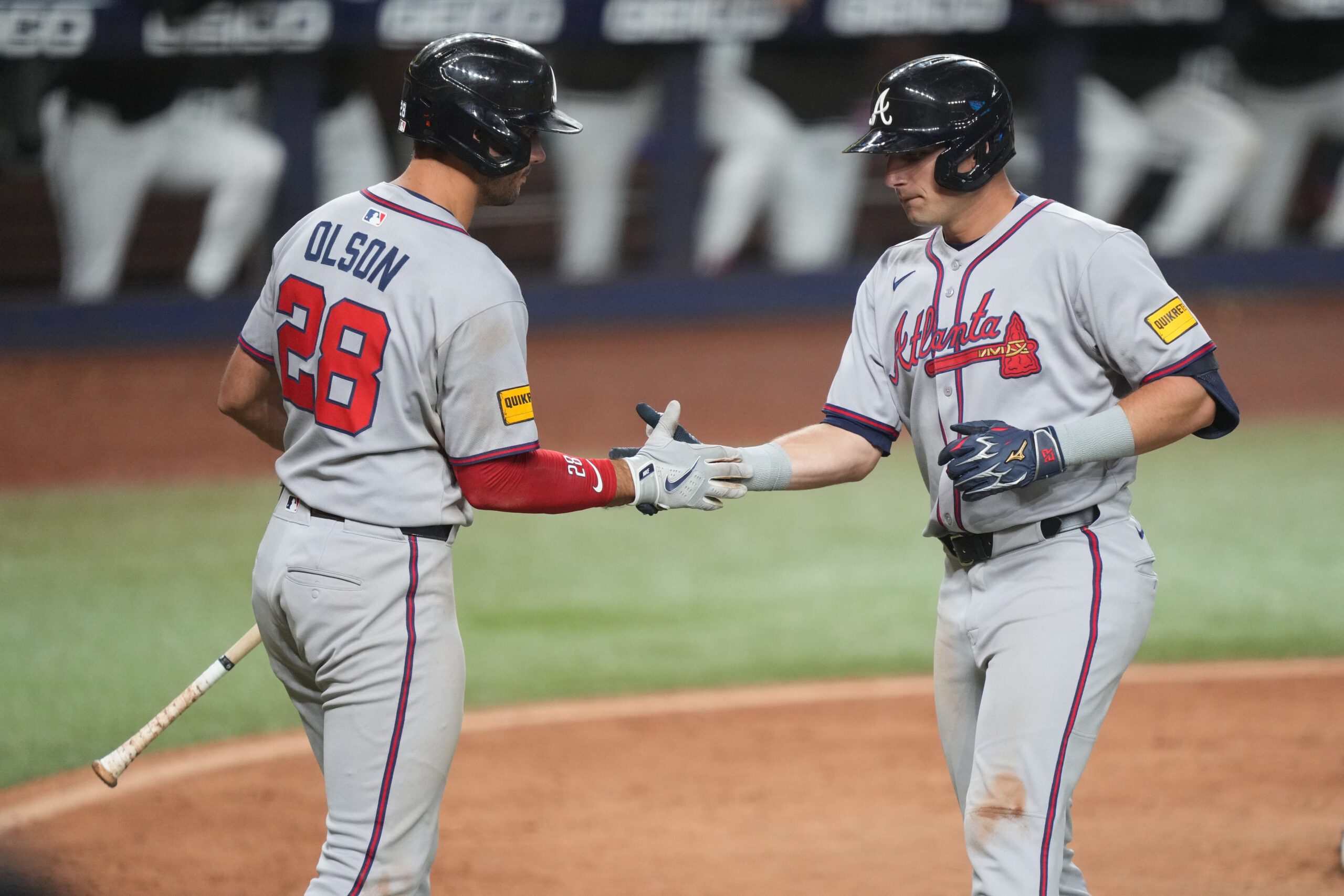 Jun 20, 2025; Miami, Florida, USA;  Atlanta Braves first baseman Matt Olson (28) congratulates third baseman Austin Riley, right, on his solo home run in the eighth inning at loanDepot Park. Mandatory Credit: Jim Rassol-Imagn Images