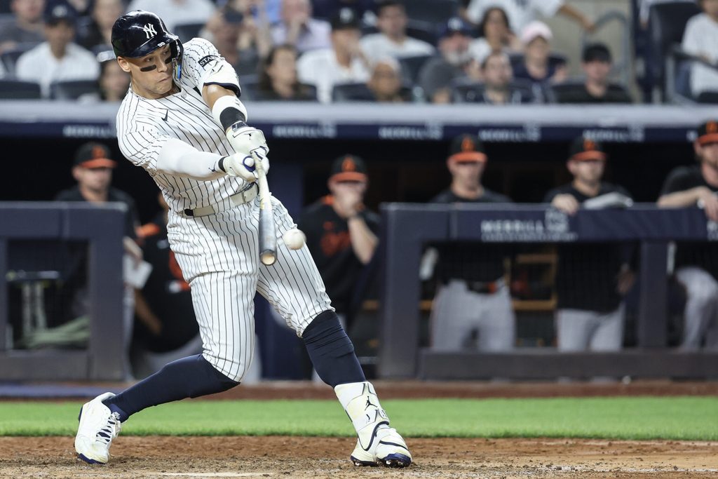Jun 20, 2025; Bronx, New York, USA; New York Yankees right fielder Aaron Judge (99) hits a single in the sixth inning against the Baltimore Orioles at Yankee Stadium. Mandatory Credit: Wendell Cruz-Imagn Images