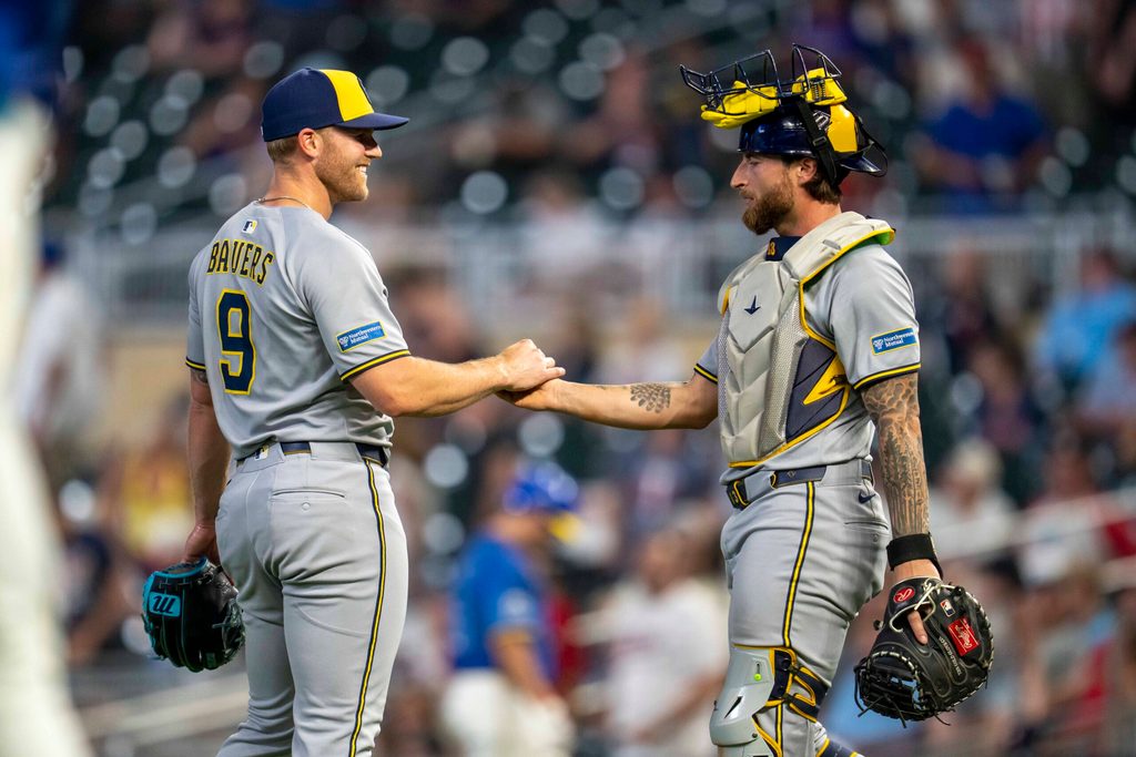 Jun 20, 2025; Minneapolis, Minnesota, USA; Milwaukee Brewers position player Jake Bauers (9) and catcher Eric Haase (13) celebrate after defeating the Minnesota Twins at Target Field. Mandatory Credit: Jesse Johnson-Imagn Images