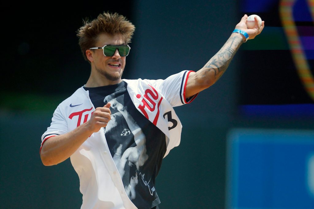 Jun 21, 2025; Minneapolis, Minnesota, USA; Minnesota safety Koi Perich throws out a ceremonial first pitch before the game between the Milwaukee Brewers and the Minnesota Twins at Target Field. Mandatory Credit: Bruce Kluckhohn-Imagn Images