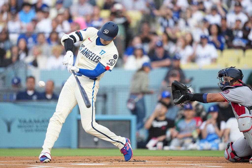 Jun 21, 2025; Los Angeles, California, USA; Los Angeles Dodgers two-way player Shohei Ohtani (17) flies out to center during the first inning against against the Washington Nationals at Dodger Stadium. Mandatory Credit: Kirby Lee-Imagn Images