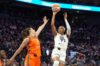 Jun 22, 2025; San Francisco, California, USA; Golden State Valkyries forward Kayla Thornton (5) shoots against Connecticut Sun forward Haley Peters (7) during the second quarter at Chase Center. Mandatory Credit: Darren Yamashita-Imagn Images