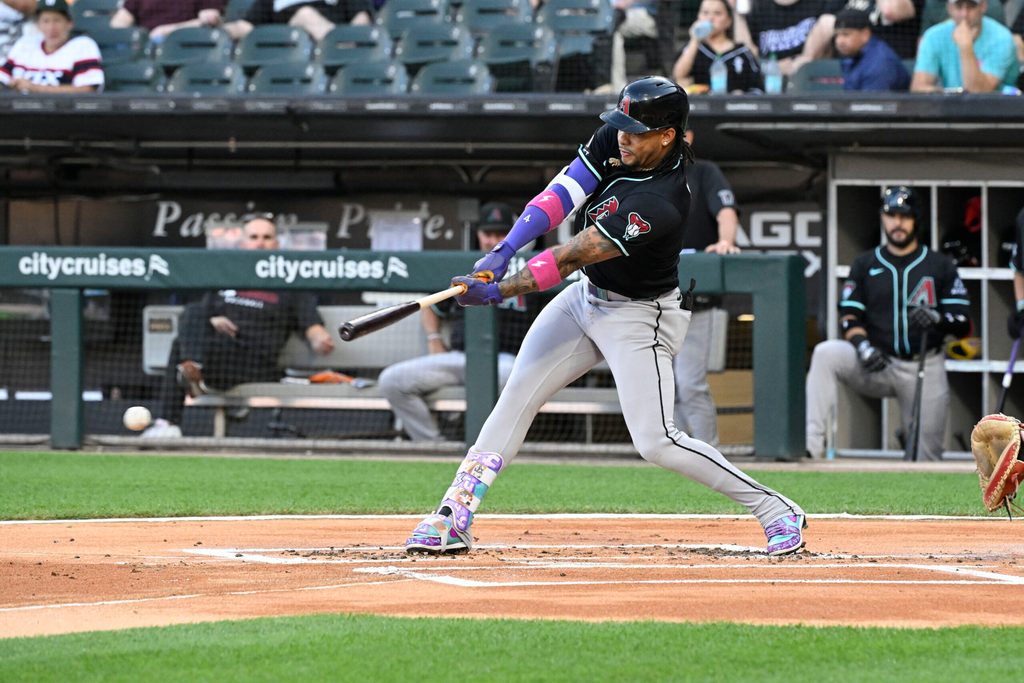 Jun 23, 2025; Chicago, Illinois, USA; Arizona Diamondbacks second baseman Ketel Marte (4) singles against the Chicago White Sox during the first inning at Rate Field. Mandatory Credit: Matt Marton-Imagn Images