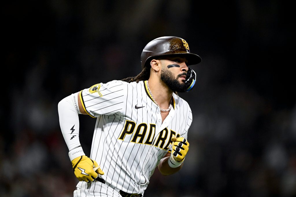 Jun 23, 2025; San Diego, California, USA; San Diego Padres right fielder Fernando Tatis Jr. (23) rounds the bases after hitting a solo home run during the ninth inning against the Washington Nationals at Petco Park. Mandatory Credit: Denis Poroy-Imagn Images