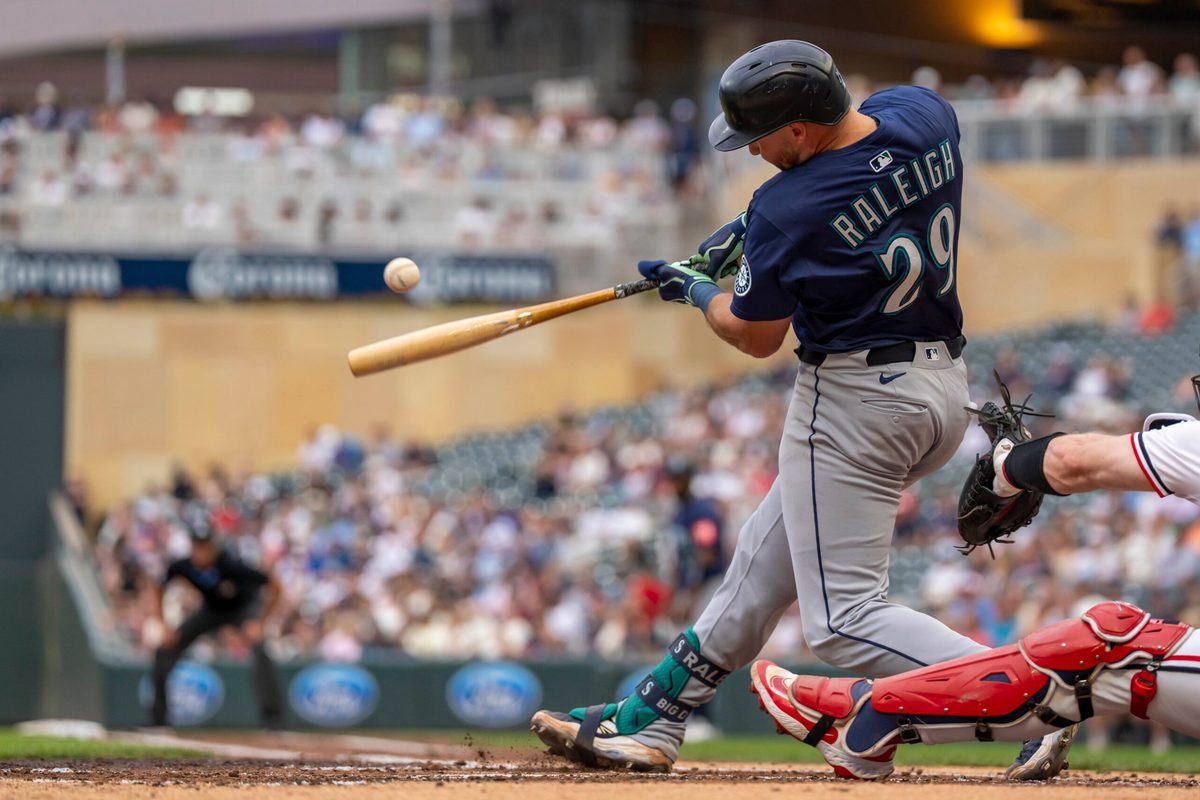 Jun 24, 2025; Minneapolis, Minnesota, USA; Seattle Mariners catcher Cal Raleigh (29) hits a RBI single against the Minnesota Twins in the third inning at Target Field. Mandatory Credit: Jesse Johnson-Imagn Images
