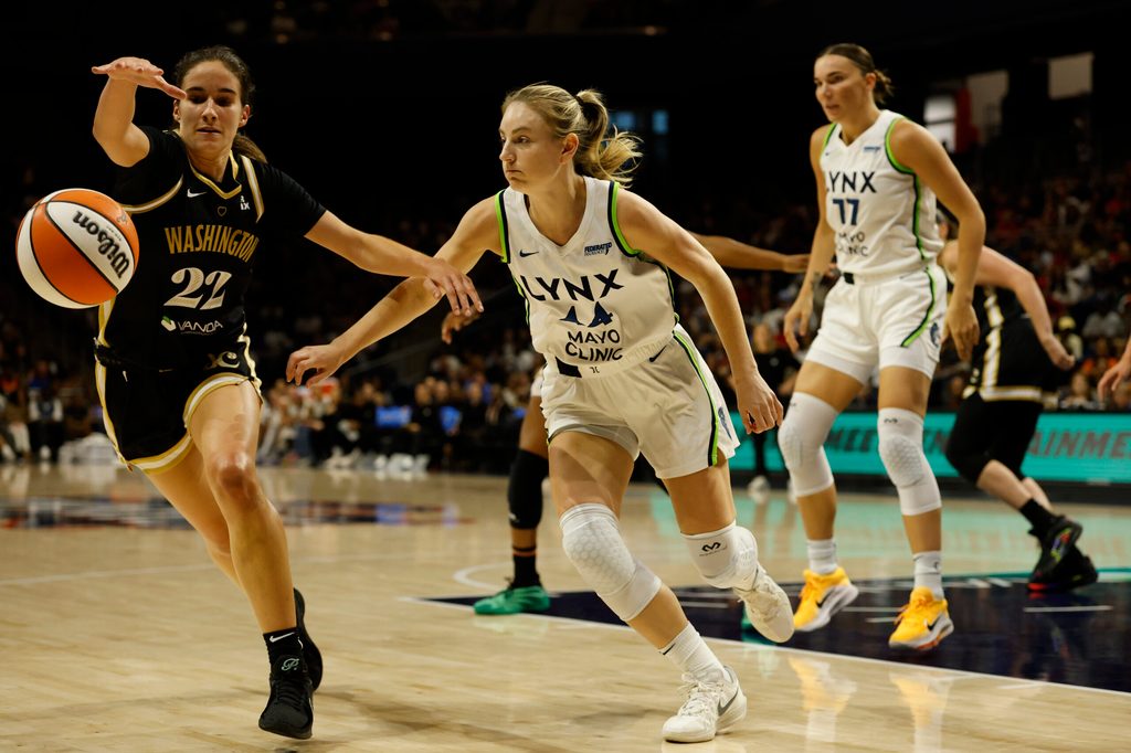 Jun 24, 2025; Washington, District of Columbia, USA; Washington Mystics guard Sonia Citron (22) and Minnesota Lynx guard Karlie Samuelson (44) chase a loose ball in the first half at Entertainment & Sports Arena. Mandatory Credit: Geoff Burke-Imagn Images