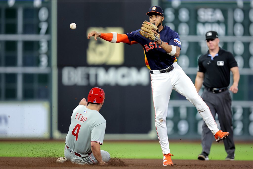 Jun 24, 2025; Houston, Texas, USA; Houston Astros shortstop Jeremy Pena (3) throws a fielded ball to first base to complete a double play against the Philadelphia Phillies during the sixth inning at Daikin Park. Mandatory Credit: Erik Williams-Imagn Images