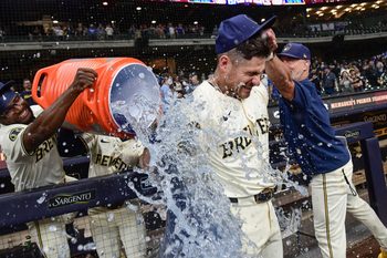 Jun 24, 2025; Milwaukee, Wisconsin, USA; Milwaukee Brewers shortstop Joey Ortiz (3) gets the post game dunk after beating the Pittsburgh Pirates at American Family Field. Mandatory Credit: Benny Sieu-Imagn Images
