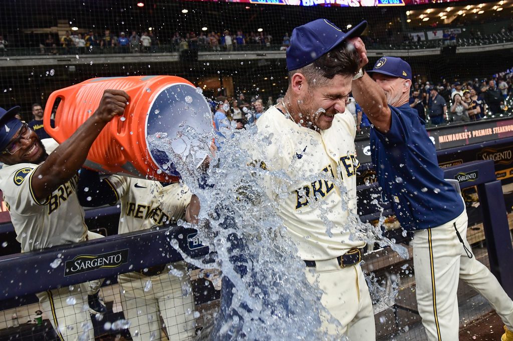 Jun 24, 2025; Milwaukee, Wisconsin, USA; Milwaukee Brewers shortstop Joey Ortiz (3) gets the post game dunk after beating the Pittsburgh Pirates at American Family Field. Mandatory Credit: Benny Sieu-Imagn Images