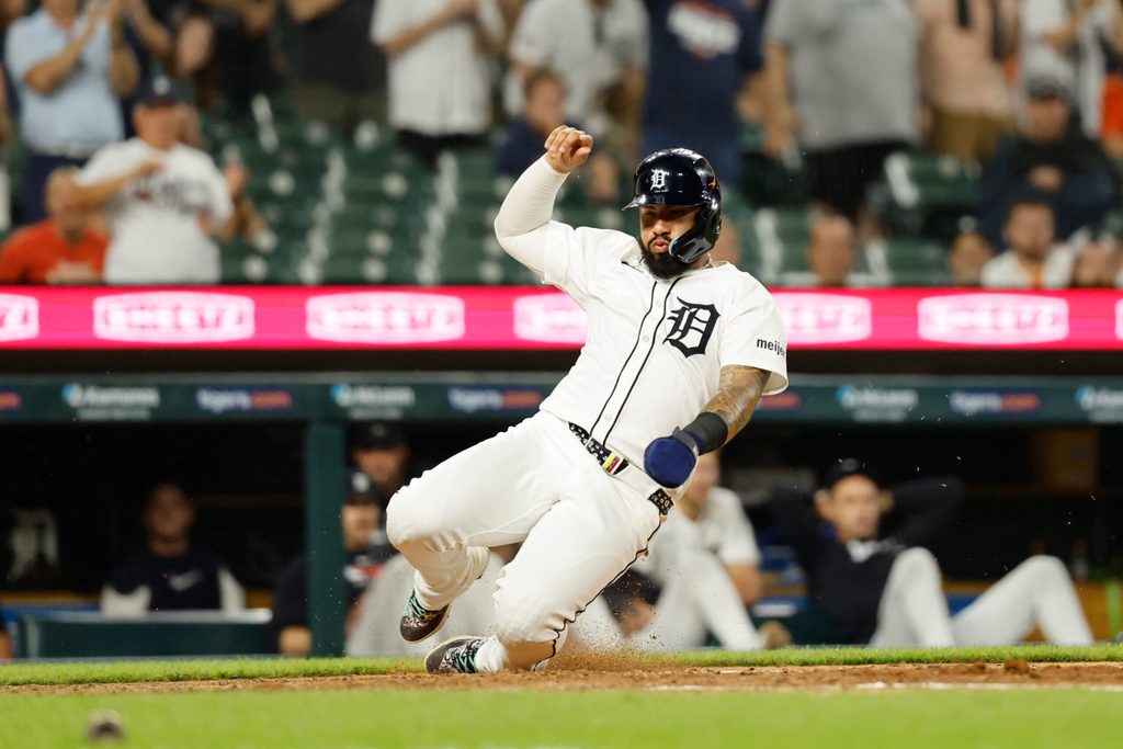 Jun 24, 2025; Detroit, Michigan, USA; Detroit Tigers outfielder Javier Baez (28) scores a run in the eighth inning against the Athletics at Comerica Park. Mandatory Credit: Rick Osentoski-Imagn Images