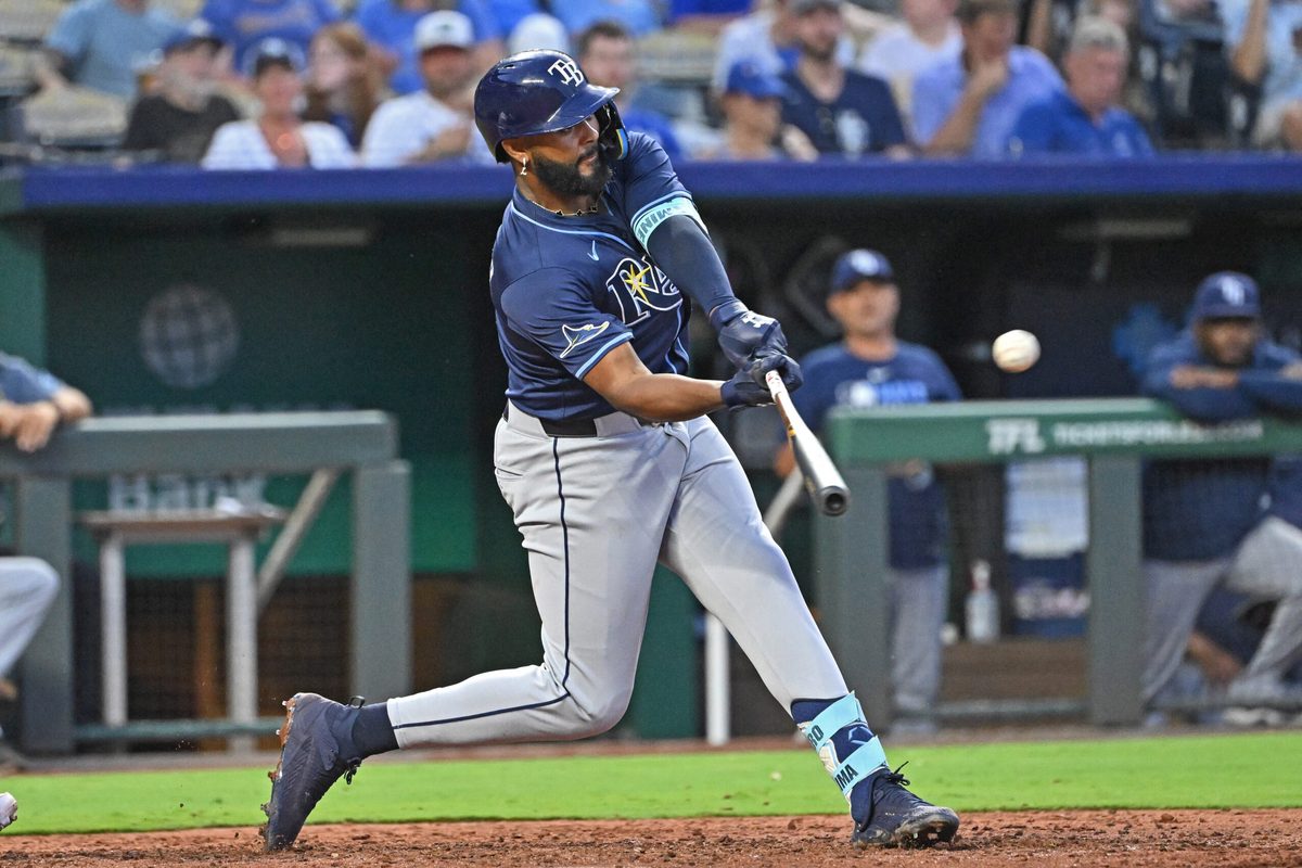 Jun 24, 2025; Kansas City, Missouri, USA;  Tampa Bay Rays right fielder Junior Caminero (13) doubles in the eighth inning against the Kansas City Royals at Kauffman Stadium. Mandatory Credit: Peter Aiken-Imagn Images