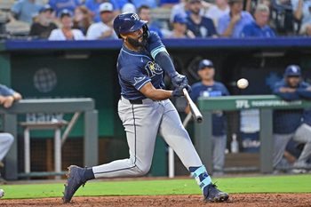 Jun 24, 2025; Kansas City, Missouri, USA;  Tampa Bay Rays right fielder Junior Caminero (13) doubles in the eighth inning against the Kansas City Royals at Kauffman Stadium. Mandatory Credit: Peter Aiken-Imagn Images