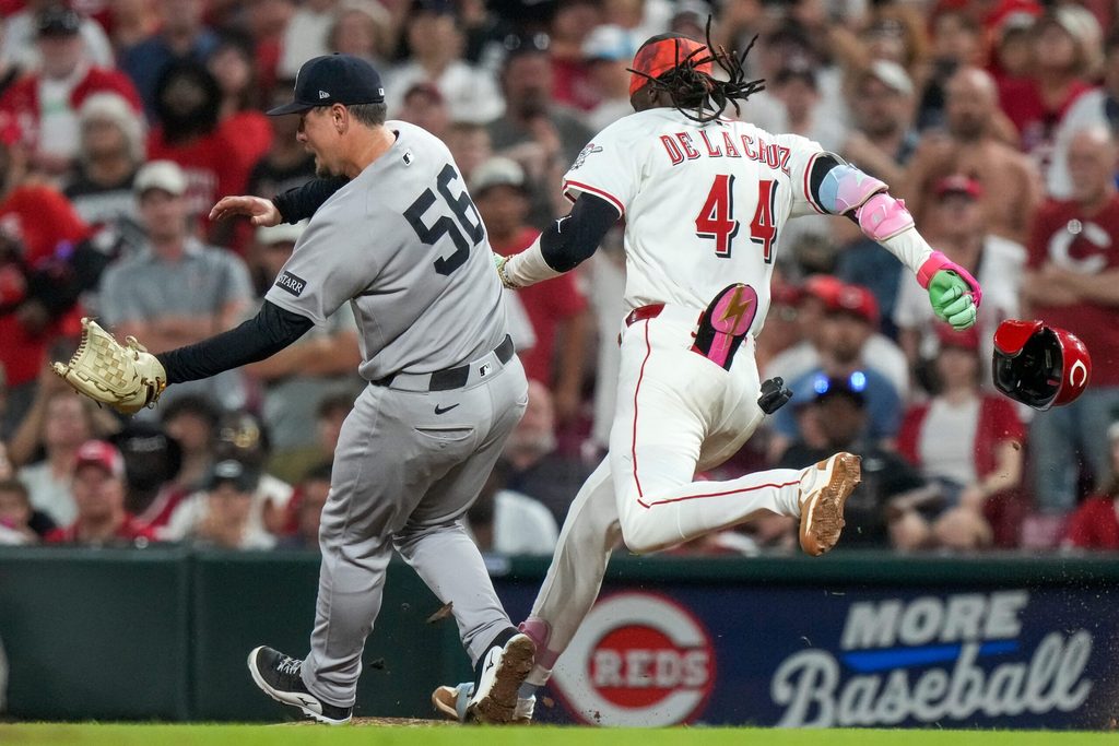 Cincinnati Reds shortstop Elly De La Cruz (44) reaches first on a single, moving Matt McLain to third base, in the 11th inning of the MLB interleague game between the Cincinnati Reds and the New York Yankees at Great American Ball Park in downtown Cincinnati on Tuesday, June 24, 2025. The Reds won 5-4 in 11 innings.