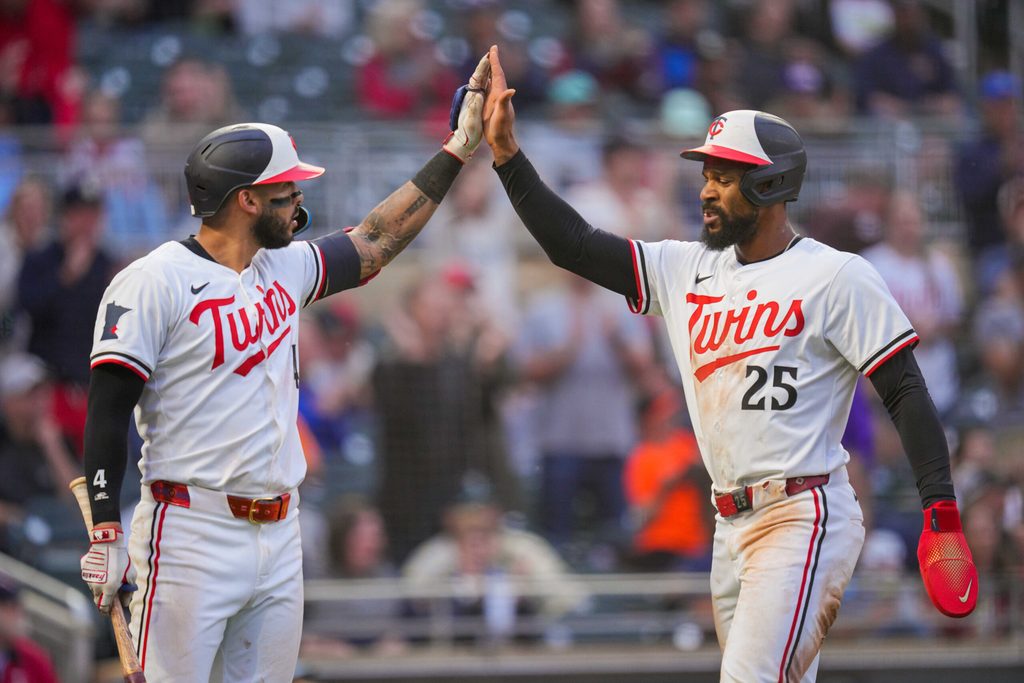 Jun 25, 2025; Minneapolis, Minnesota, USA; Minnesota Twins outfielder Byron Buxton (25) celebrates his run with shortstop Carlos Correa (4) against the Seattle Mariners in the sixth inning at Target Field. Mandatory Credit: Brad Rempel-Imagn Images