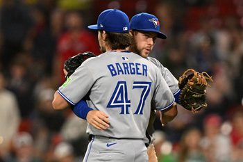 Jun 27, 2025; Boston, Massachusetts, USA; Toronto Blue Jays third baseman Addison Barger (47) celebrates with third baseman Ernie Clement (22) after a game against the Boston Red Sox at Fenway Park. Mandatory Credit: Brian Fluharty-Imagn Images
