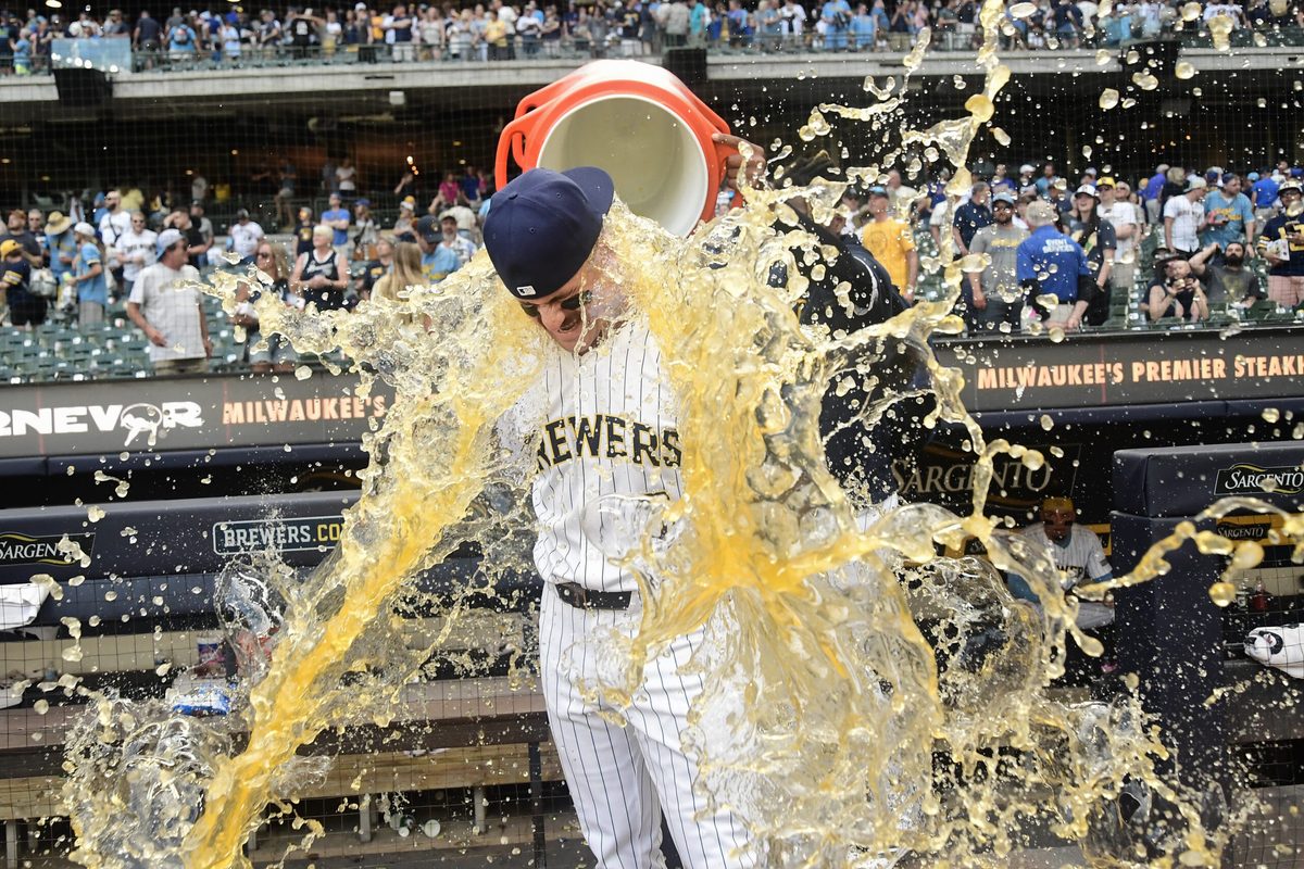 Jun 28, 2025; Milwaukee, Wisconsin, USA;  Milwaukee Brewers shortstop Joey Ortiz (3) gets the post game dunk after the Brewers defeated the Colorado Rockies at American Family Field. Mandatory Credit: Benny Sieu-Imagn Images