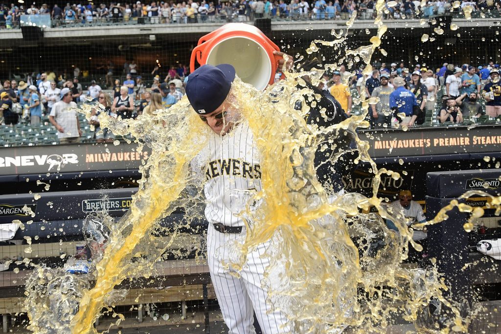 Jun 28, 2025; Milwaukee, Wisconsin, USA; Milwaukee Brewers shortstop Joey Ortiz (3) gets the post game dunk after the Brewers defeated the Colorado Rockies at American Family Field. Mandatory Credit: Benny Sieu-Imagn Images