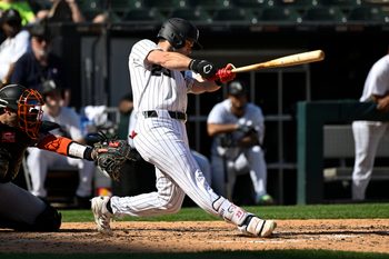 Jun 28, 2025; Chicago, Illinois, USA; Chicago White Sox outfielder Andrew Benintendi (23) hits a home run against the San Francisco Giants during the seventh inning at Rate Field. Mandatory Credit: Matt Marton-Imagn Images