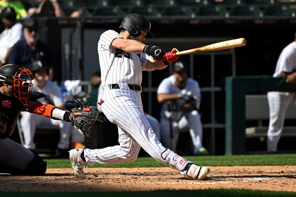 Jun 28, 2025; Chicago, Illinois, USA; Chicago White Sox outfielder Andrew Benintendi (23) hits a home run against the San Francisco Giants during the seventh inning at Rate Field. Mandatory Credit: Matt Marton-Imagn Images