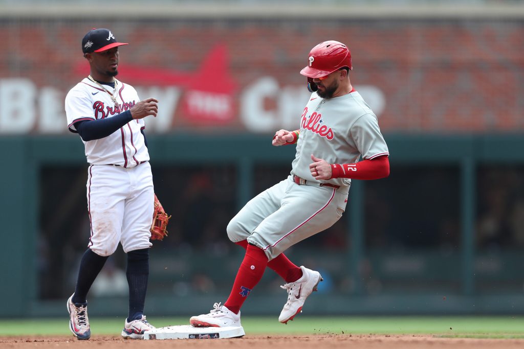 Jun 29, 2025; Cumberland, Georgia, Philadelphia Phillies left fielder Kyle Schwarber (12) steals second base next to Atlanta Braves second baseman Ozzie Albies (1) during the fifth inning at Truist Park. Mandatory Credit: Mady Mertens-Imagn Images