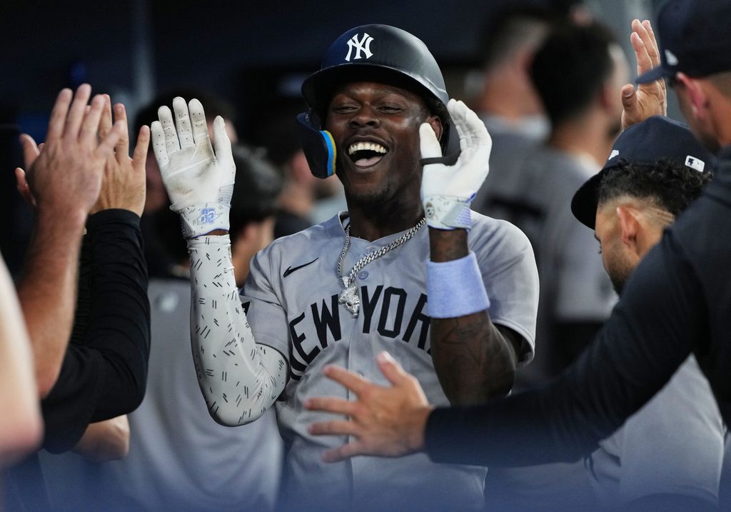 Jun 30, 2025; Toronto, Ontario, CAN; New York Yankees third baseman Jazz Chisholm Jr. (13) celebrates in the dugout after hitting a two-run home run against the Toronto Blue Jays during the fourth inning at Rogers Centre. Mandatory Credit: Nick Turchiaro-Imagn Images