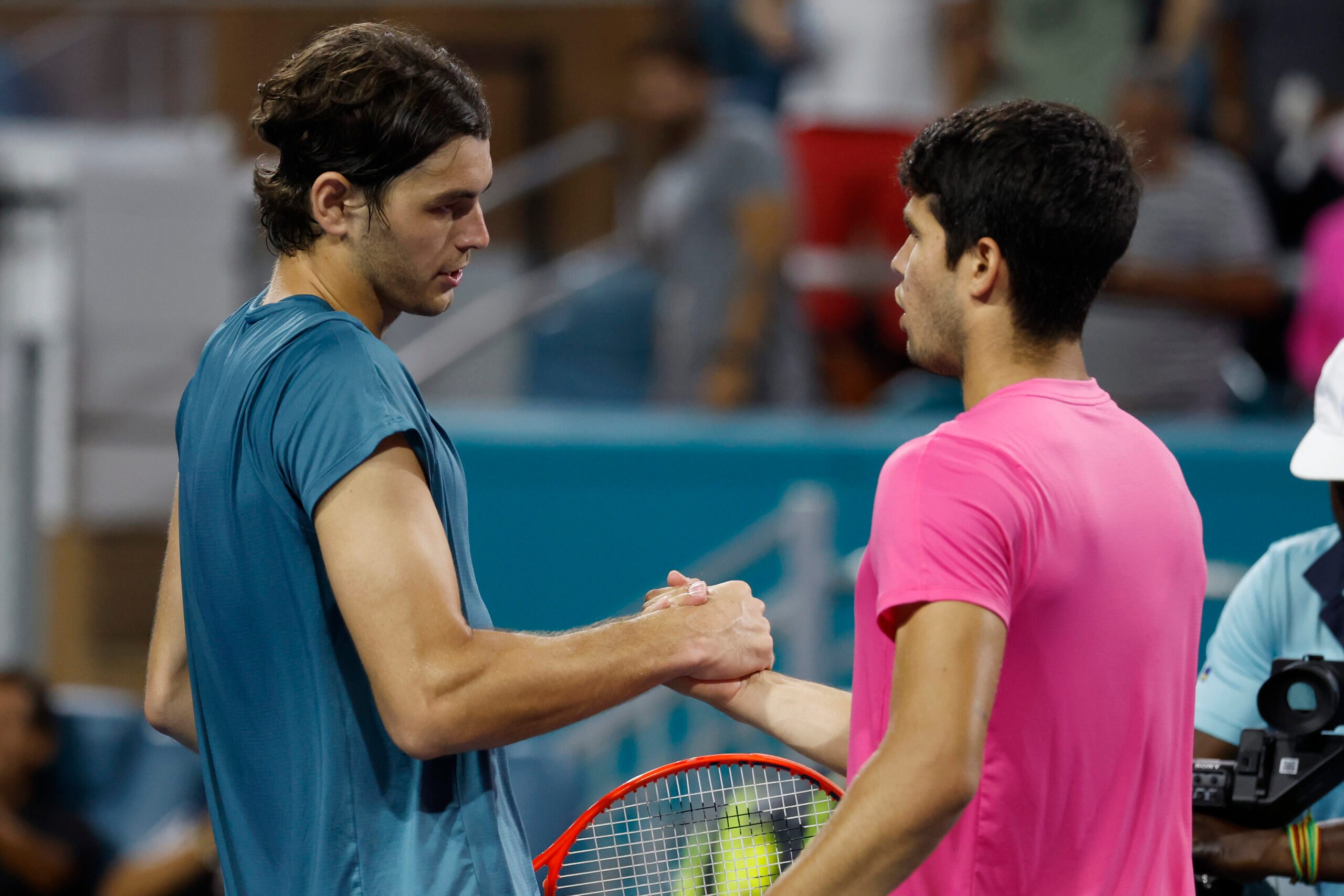 Mar 30, 2023; Miami, Florida, US; Carlos Alcaraz (ESP) (R) shakes hands with Taylor Fritz (USA) (L) after their men's singles quarterfinal on day eleven of the Miami Open at Hard Rock Stadium. Mandatory Credit: Geoff Burke-Imagn Images
