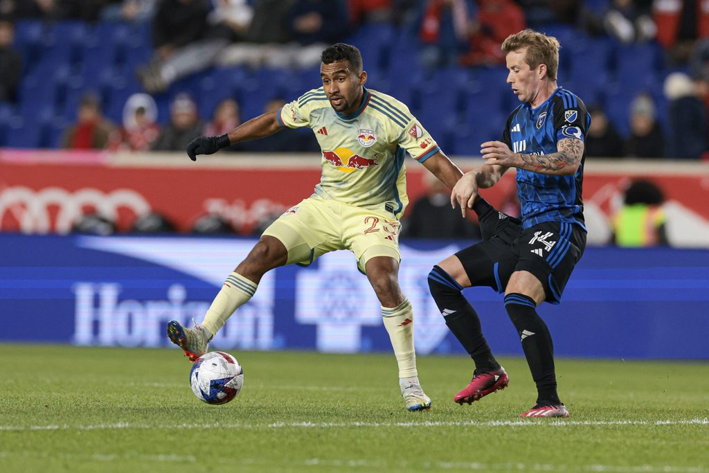 Apr 8, 2023; Harrison, New Jersey, USA; New York Red Bulls midfielder Cristian Casseres Jr (23) controls the ball against San Jose Earthquakes midfielder Jackson Yueill (14) during the second half at Red Bull Arena. Mandatory Credit: Vincent Carchietta-Imagn Images