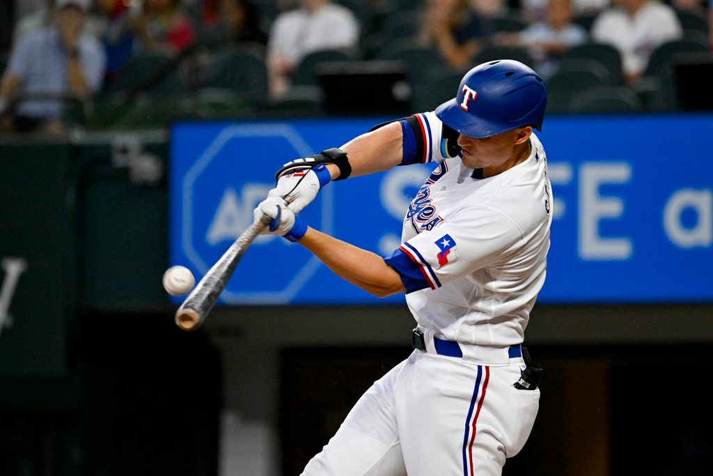 Aug 3, 2023; Arlington, Texas, USA; Texas Rangers designated hitter Corey Seagar (5) bats against the Chicago White Sox during the third inning at Globe Life Field. Mandatory Credit: Jerome Miron-Imagn Images