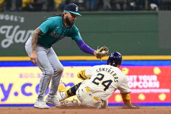 Apr 7, 2024; Milwaukee, Wisconsin, USA; Seattle Mariners shortstop J.P. Crawford (3) tags out Milwaukee Brewers catcher William Contreras (24) trying to stretch a single in the fourth inning at American Family Field. Mandatory Credit: Benny Sieu-Imagn Images