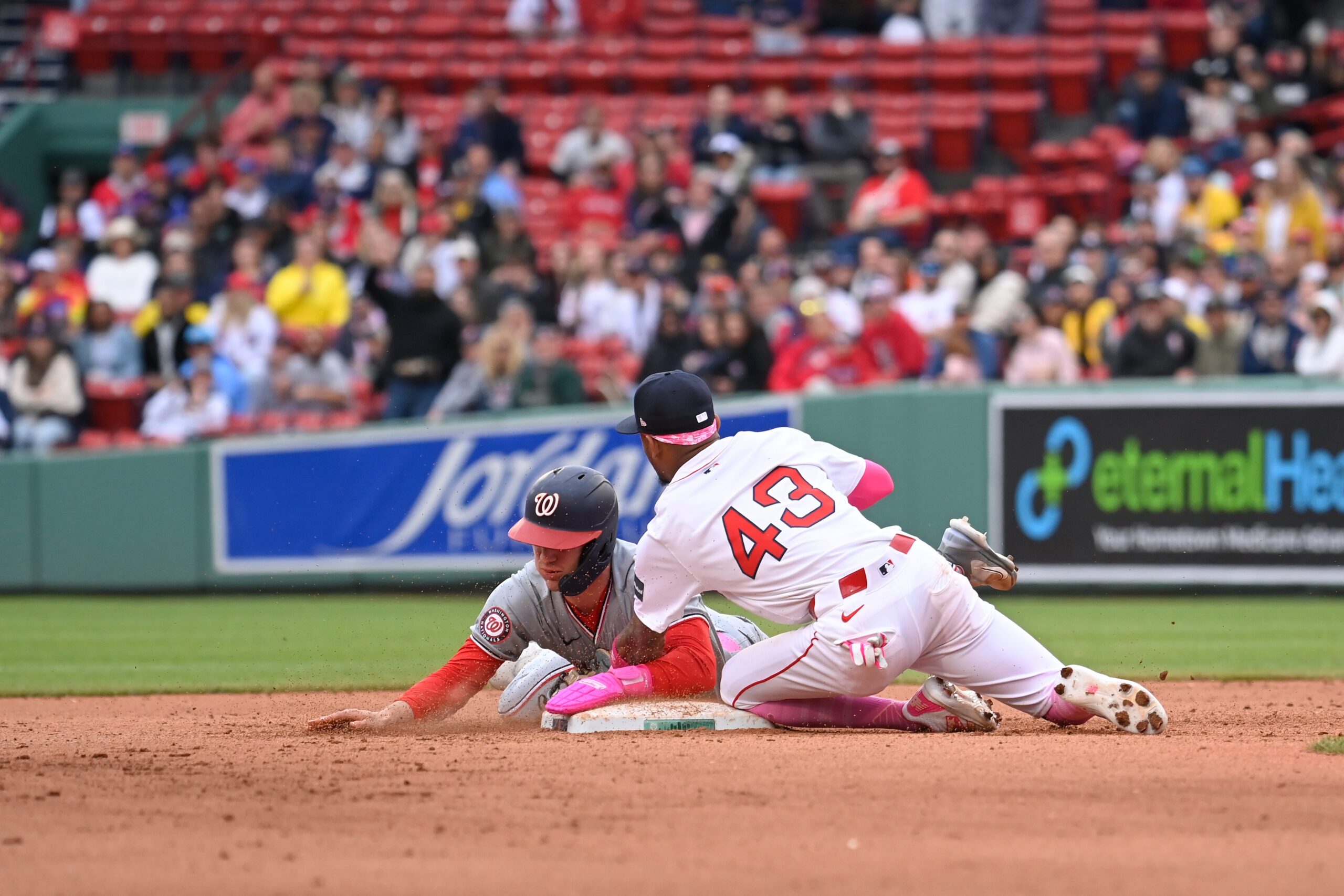 May 12, 2024; Boston, Massachusetts, USA; Boston Red Sox center fielder Ceddanne Rafaela (43) tags Washington Nationals Jacob Young (30) out to end the game and beat the Washington Nationals at Fenway Park. Mandatory Credit: Eric Canha-Imagn Images
