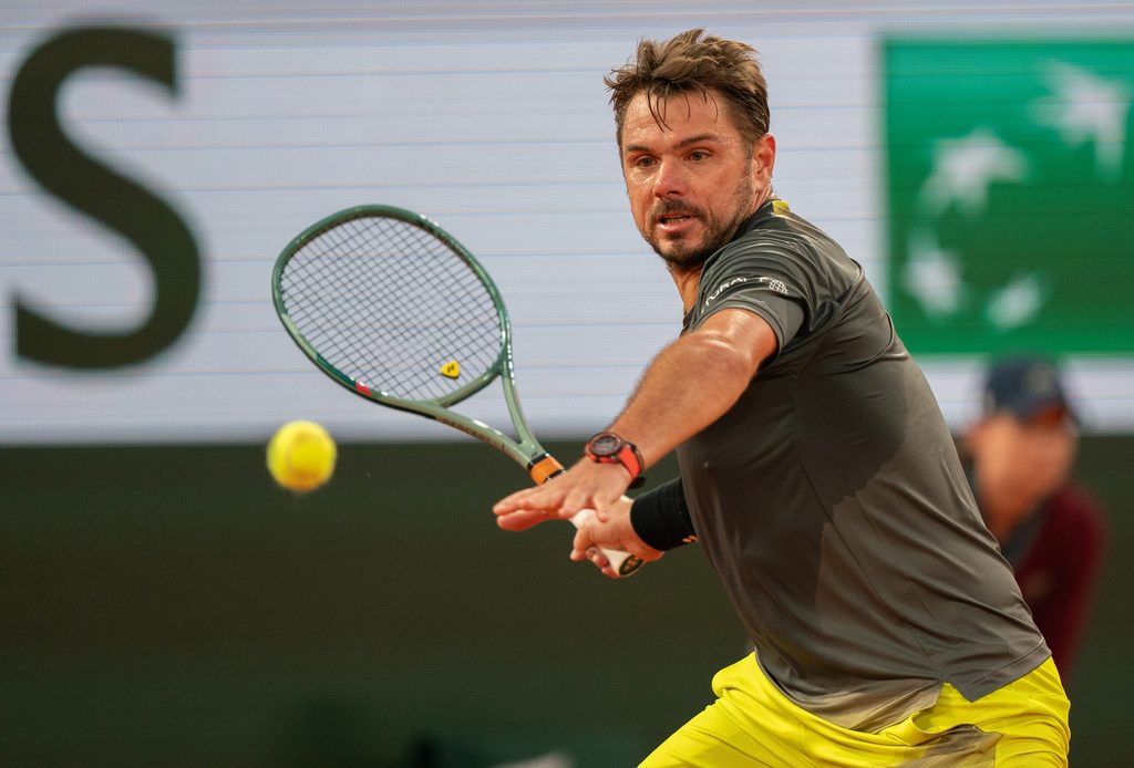 May 26, 2024; Paris, France; Stan Wawrinka of Switzerland returns a shot during his match against Andy Murray of Great Britain on day one of Roland Garros at Stade Roland Garros. Mandatory Credit: Susan Mullane-Imagn Images