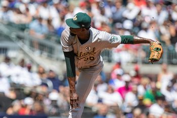 Jun 2, 2024; Cumberland, Georgia, USA;  Oakland Athletics pitcher Dany Jiménez (56) pitches the ball against the Atlanta Braves during the eighth inning at Truist Park. Mandatory Credit: Jordan Godfree-Imagn Images