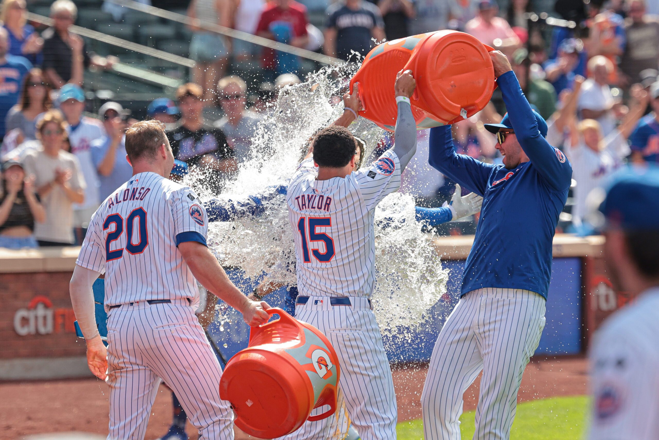 Aug 21, 2024; New York City, New York, USA; New York Mets left fielder Jesse Winker (3) celebrates with teammates after hitting a game-winning solo home run during the bottom of the ninth inning against the Baltimore Orioles at Citi Field. Mandatory Credit: Vincent Carchietta-Imagn Images