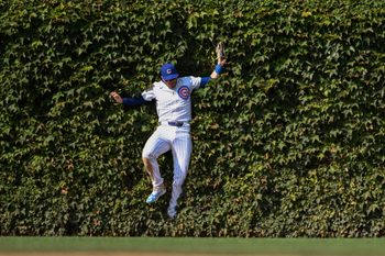 Sep 8, 2024; Chicago, Illinois, USA;  Chicago Cubs outfielder Ian Happ (8) catches a fly ball hit by New York Yankees catcher Austin Wells (28) during the eighth inning at Wrigley Field. Mandatory Credit: Matt Marton-Imagn Images