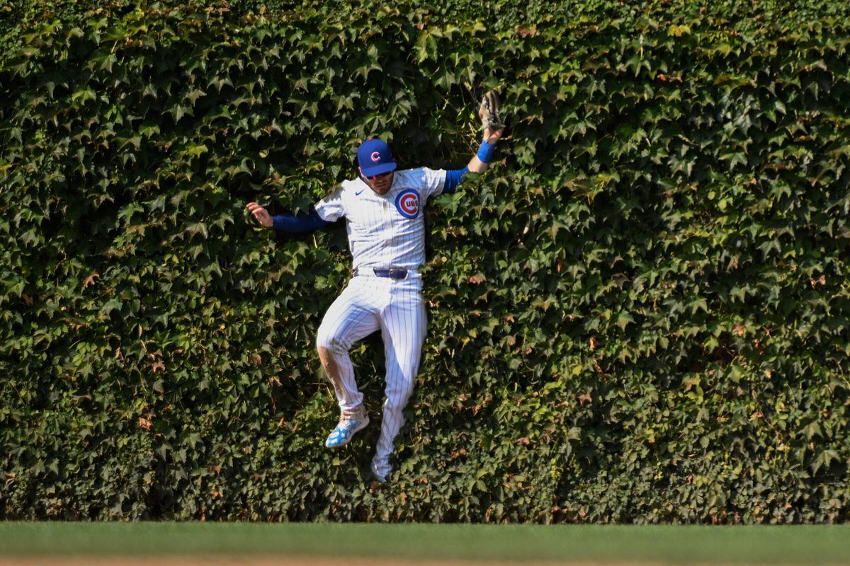 Sep 8, 2024; Chicago, Illinois, USA; Chicago Cubs outfielder Ian Happ (8) catches a fly ball hit by New York Yankees catcher Austin Wells (28) during the eighth inning at Wrigley Field. Mandatory Credit: Matt Marton-Imagn Images