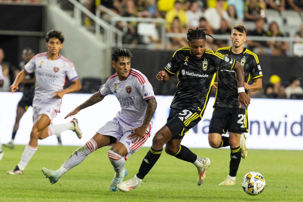 Sep 21, 2024; Columbus, Ohio, USA; Columbus Crew defender Steven Moreira (31) dribbles the ball while Orlando City midfielder Facundo Torres (10) defends in the second half at Lower.com Field. Mandatory Credit: Trevor Ruszkowski-Imagn Images