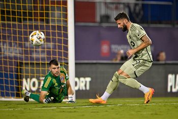 Sep 21, 2024; Frisco, Texas, USA; FC Dallas goalkeeper Maarten Paes (30) turns aside a shot as Los Angeles FC forward Olivier Giroud (9) looks for the rebound during the second half at Toyota Stadium. Mandatory Credit: Jerome Miron-Imagn Images