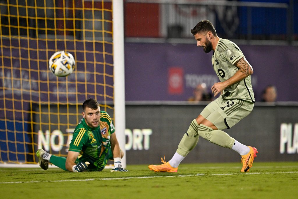 Sep 21, 2024; Frisco, Texas, USA; FC Dallas goalkeeper Maarten Paes (30) turns aside a shot as Los Angeles FC forward Olivier Giroud (9) looks for the rebound during the second half at Toyota Stadium. Mandatory Credit: Jerome Miron-Imagn Images