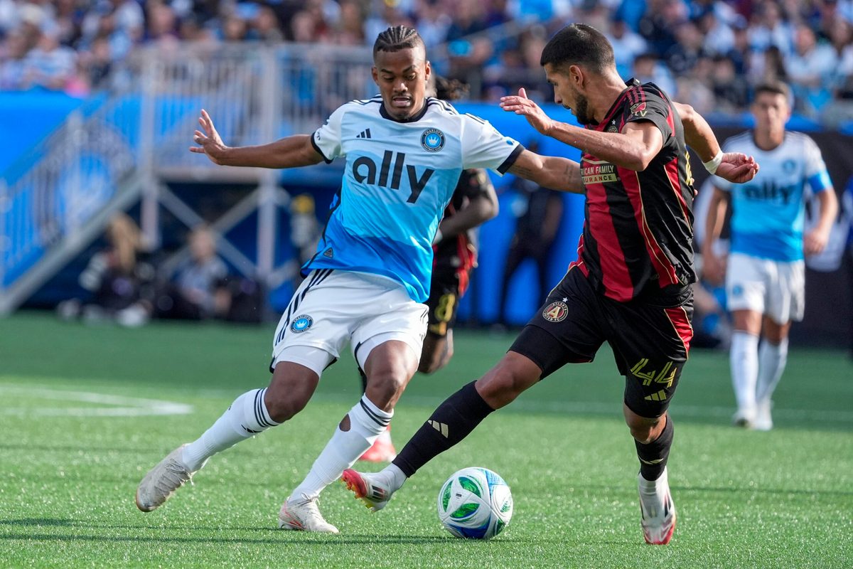 Mar 1, 2025; Charlotte, North Carolina, USA; Charlotte FC forward Kerwin Vargas (18) and Atlanta United defender Luis Abram (44) battle for the ball during the second half at Bank of America Stadium. Mandatory Credit: Jim Dedmon-Imagn Images
